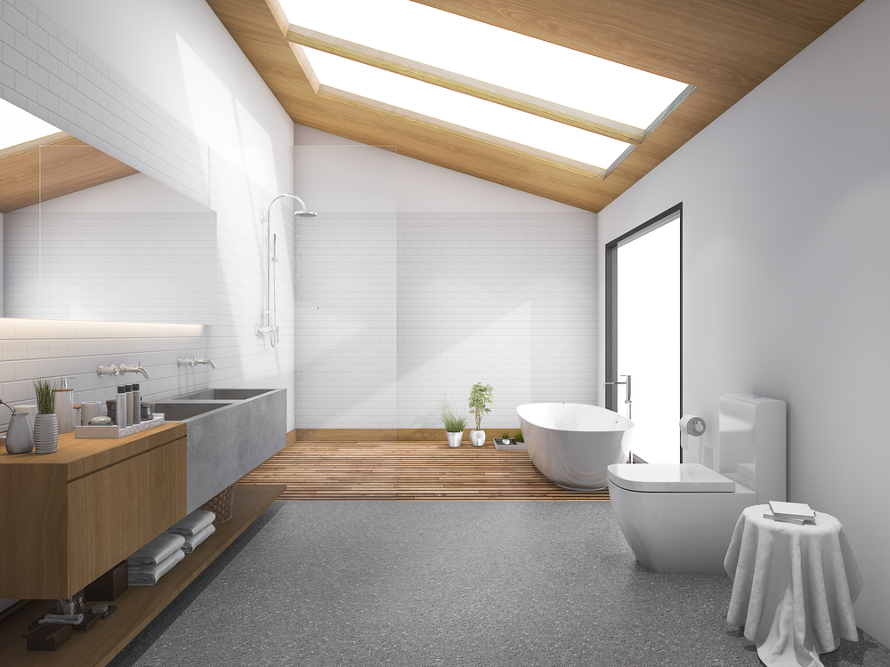 Grandes fenêtres de toit dans des combles aménagés en salle de bain